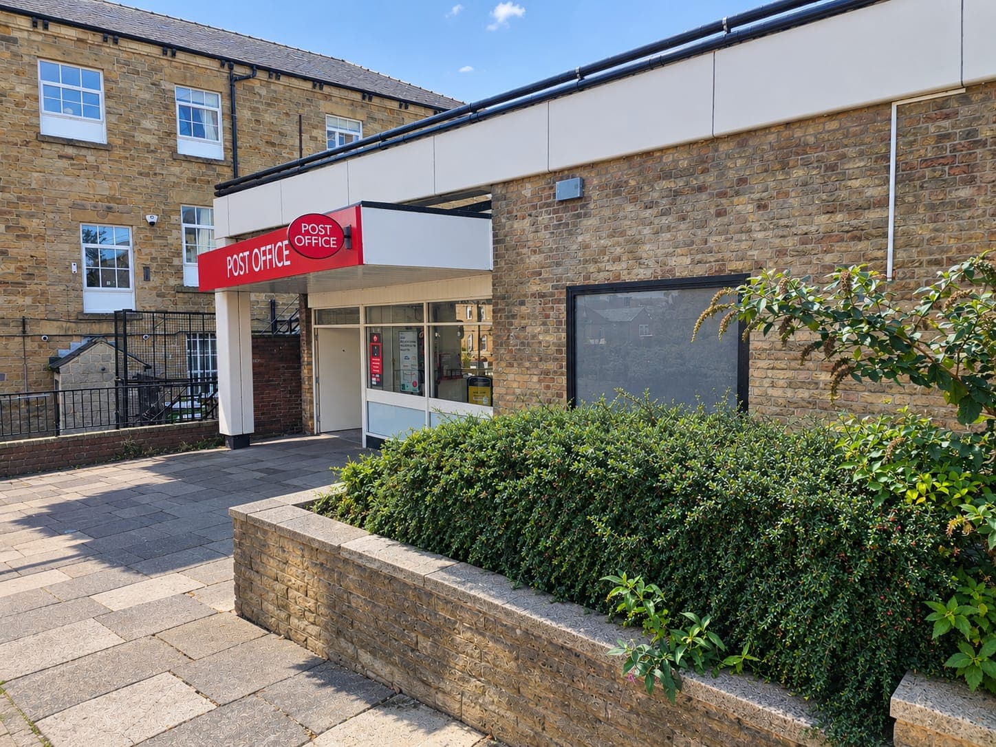 Commercial exterior cleaning at a Post Office branch - clean entrance, signage and glazing